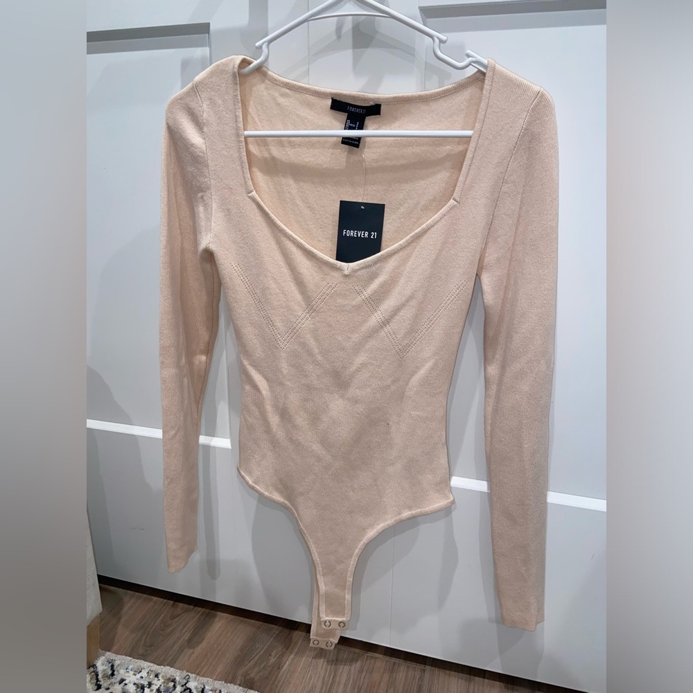 Long sleeve light pink bodysuit